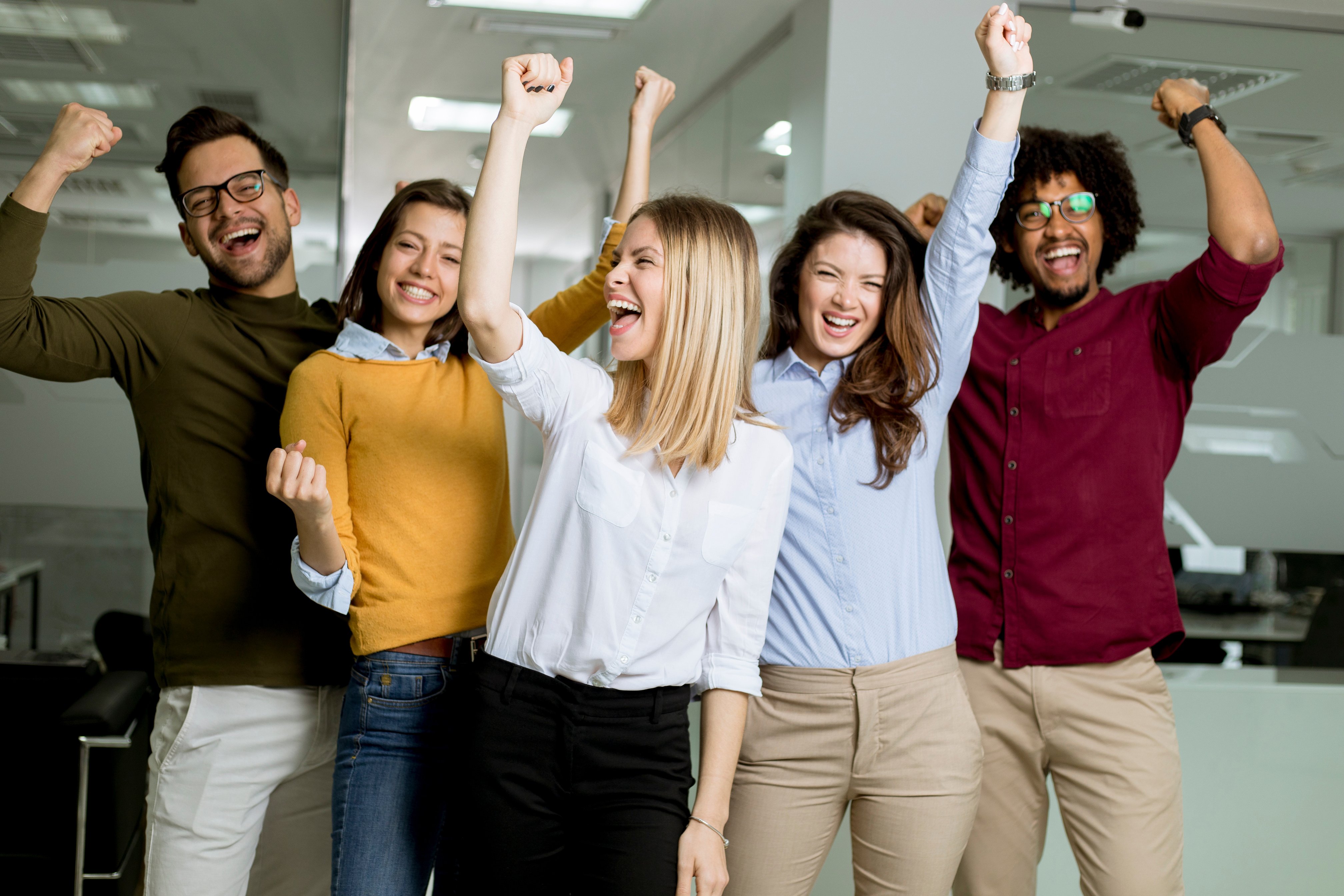 Group of Young Excited Business People with Hands up 